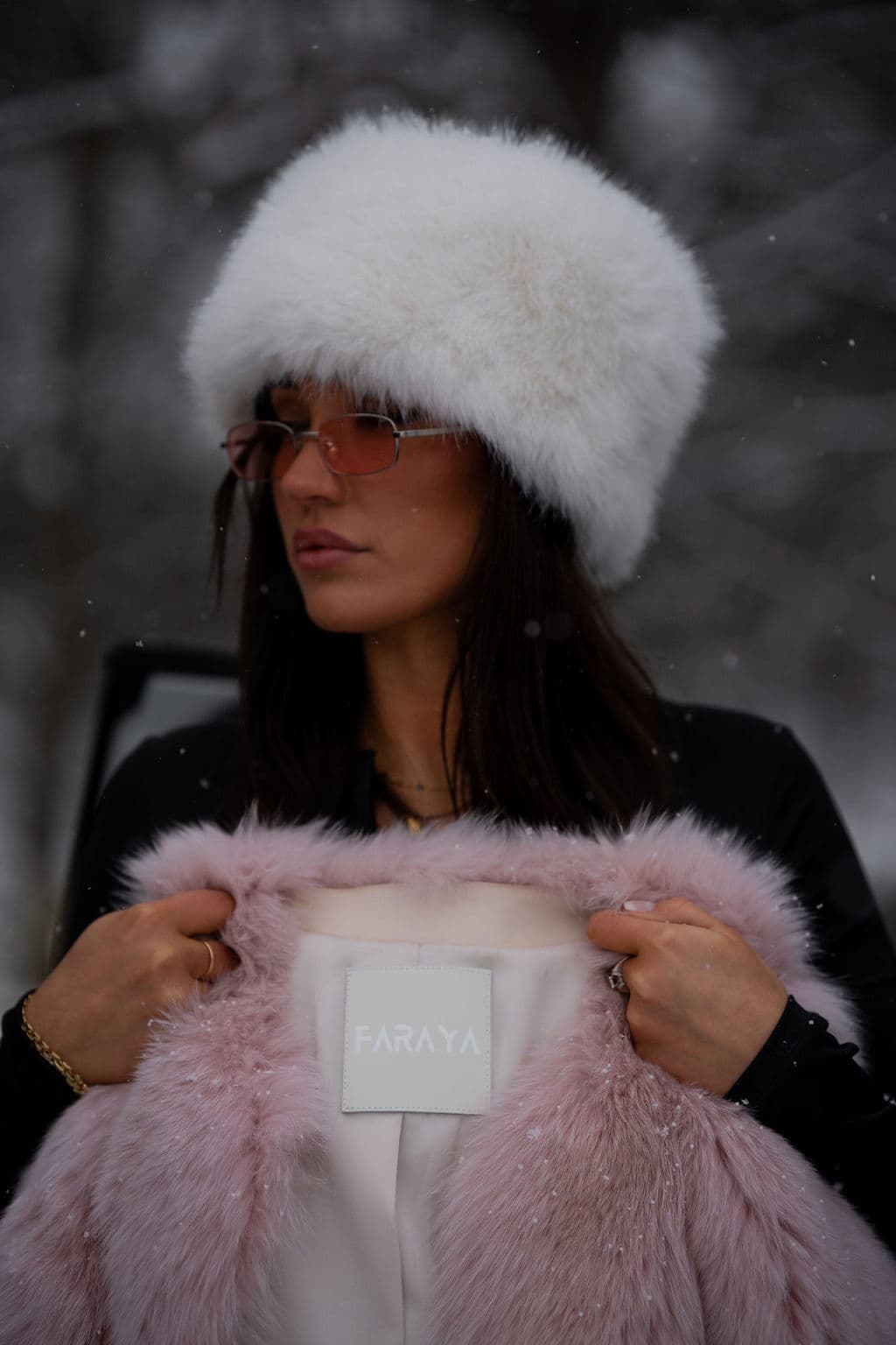 A blush fox jacket held open to show the FARAYA label inside.